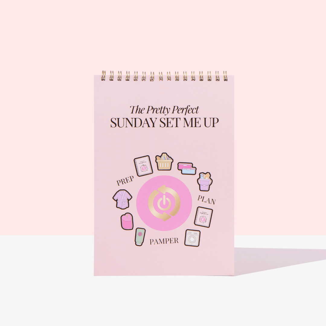 Pink planner with icons and text on a white background