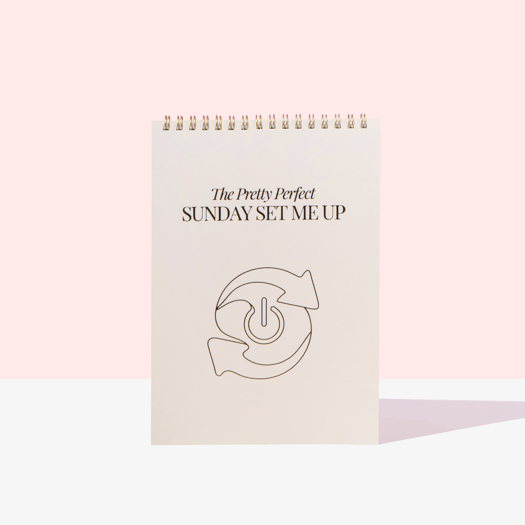 Notebook titled 'The Pretty Perfect Sunday Set Me Up' on a light pink background