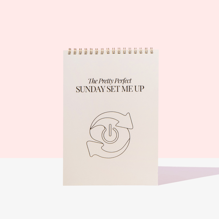 Notebook titled 'The Pretty Perfect Sunday Set Me Up' on a light pink background